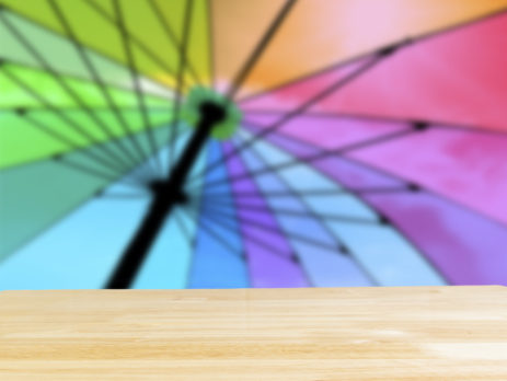 Deck furniture umbrella in rainbow colors
