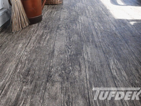Rustic vinyl plank flooring installed by Tufdek