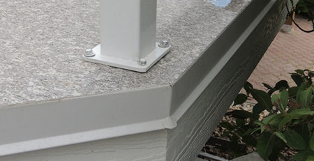 Deck flashing with drip edge on newly finished deck