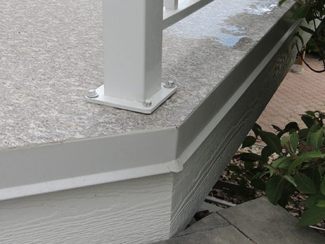 Deck flashing with drip edge on newly finished deck