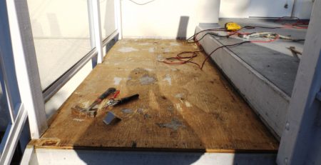 Stripped deck being prepped for vinyl decking installation