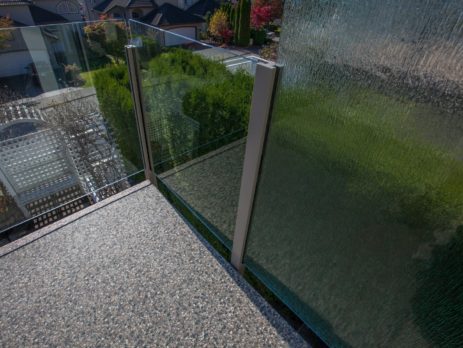 Vinyl covered deck with opaque glass wall