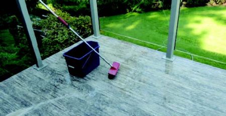 Mop and bucket on a wet vinyl covered deck