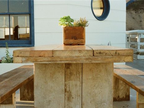 IMAGE OF WOODEN DECK TABLE AND BENCHES