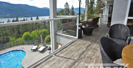 Waterproof vinyl deck with lake view and overlooking a pool