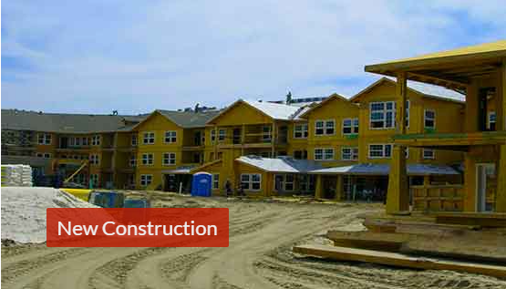 Photo of new construction condominium units being built.