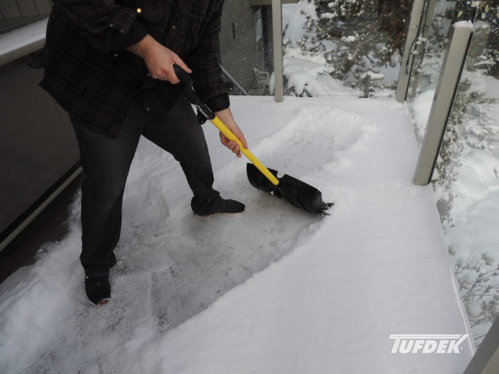 How To Winter Proof Your Deck? How To Winter Proof Your Deck against snow and moisture - man shovelling deck snow